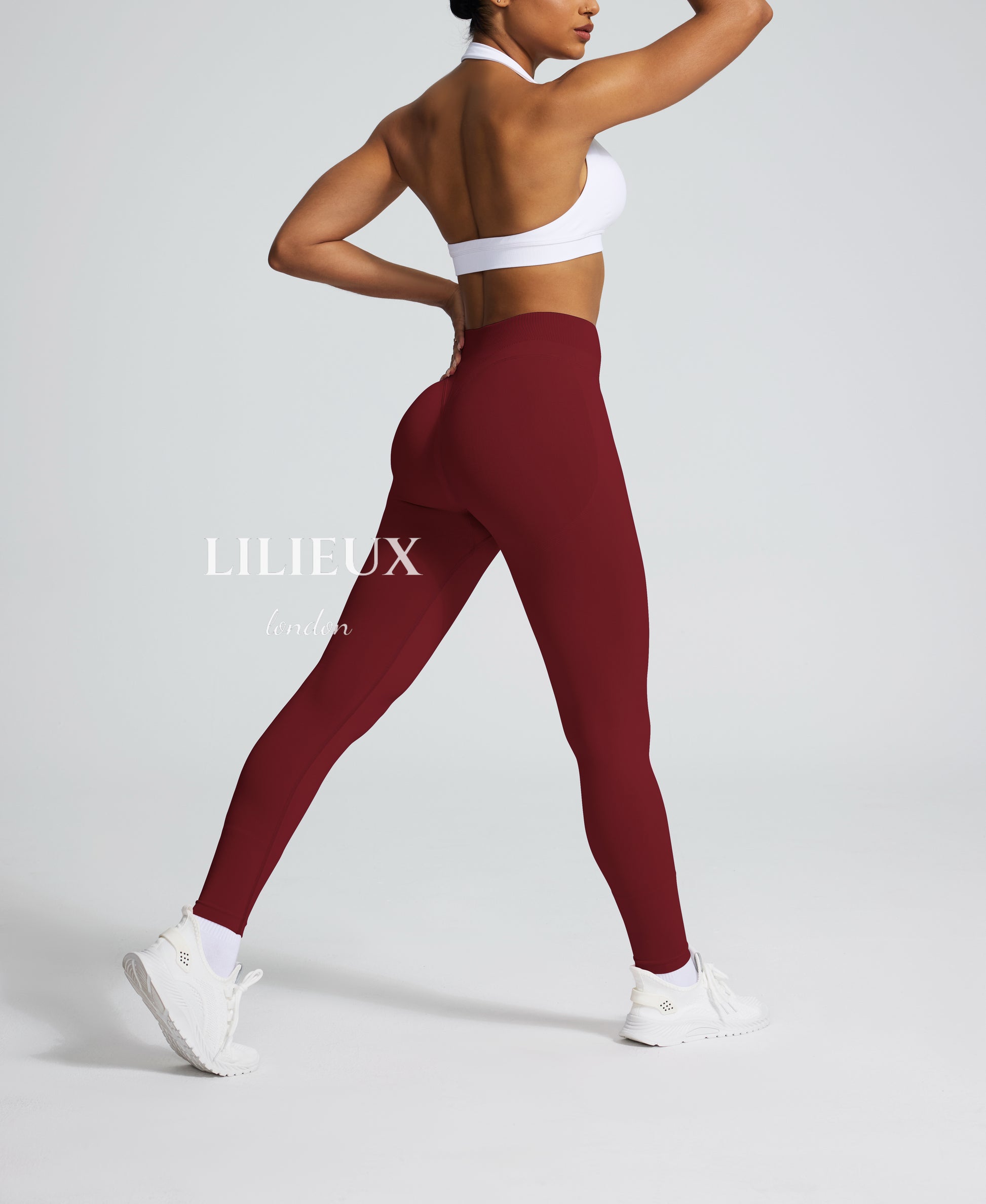 Seamless high-waisted burgundy leggings with a butt-lifting effect, designed for gym workouts, yoga, and activewear fashion.