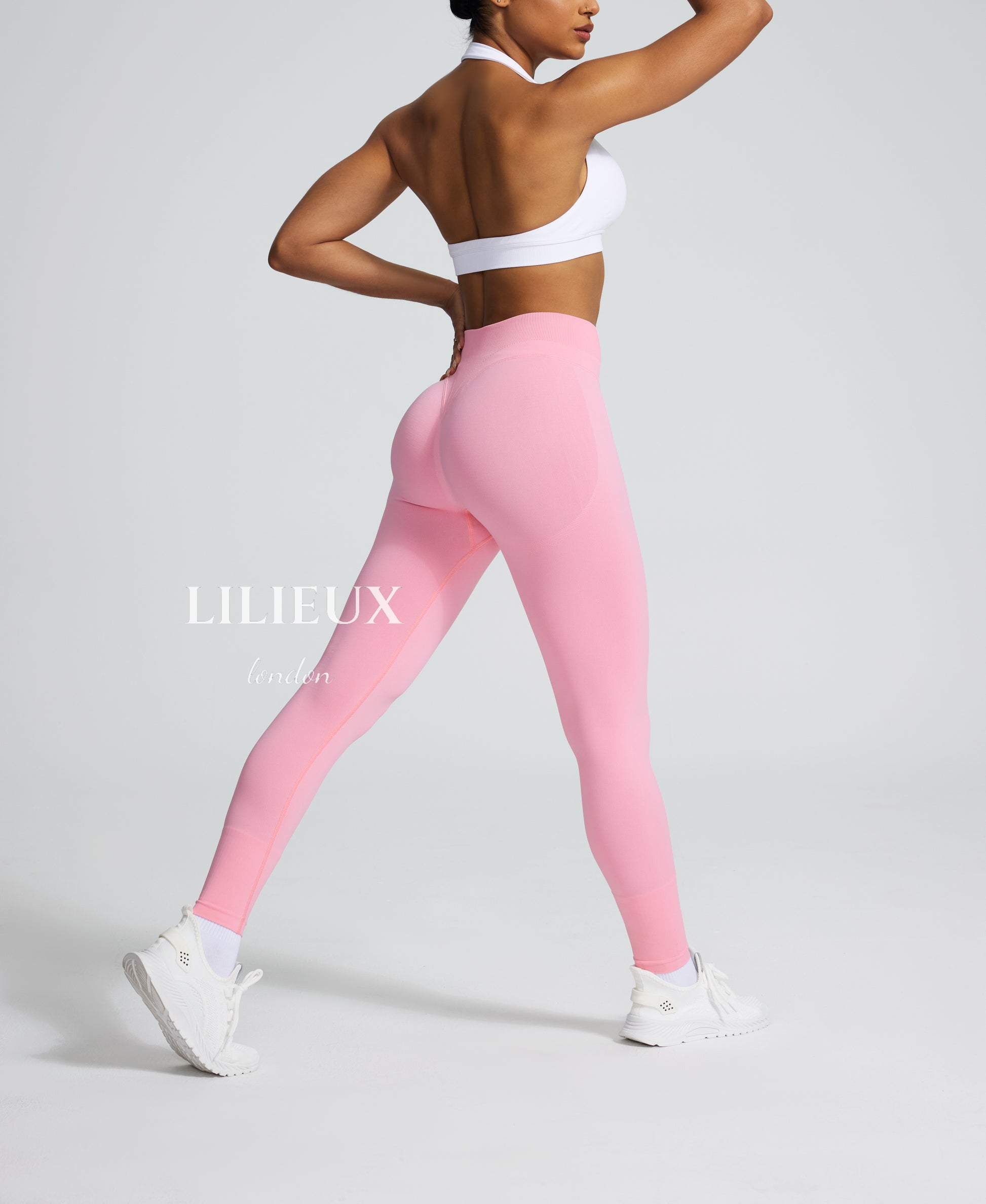 Seamless high-waisted pink leggings with a butt-lifting effect, perfect for gym workouts, yoga, and activewear fashion.