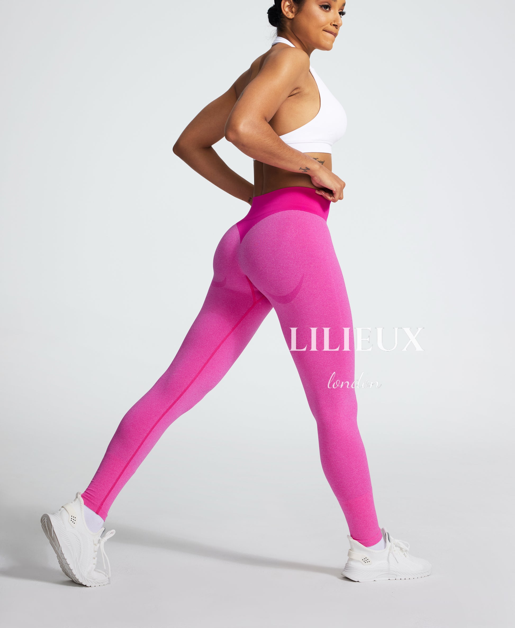 Women's high-waist butt-enhancing leggings in pink, featuring a seamless stretchy fabric for comfort, support, and a sculpted look.