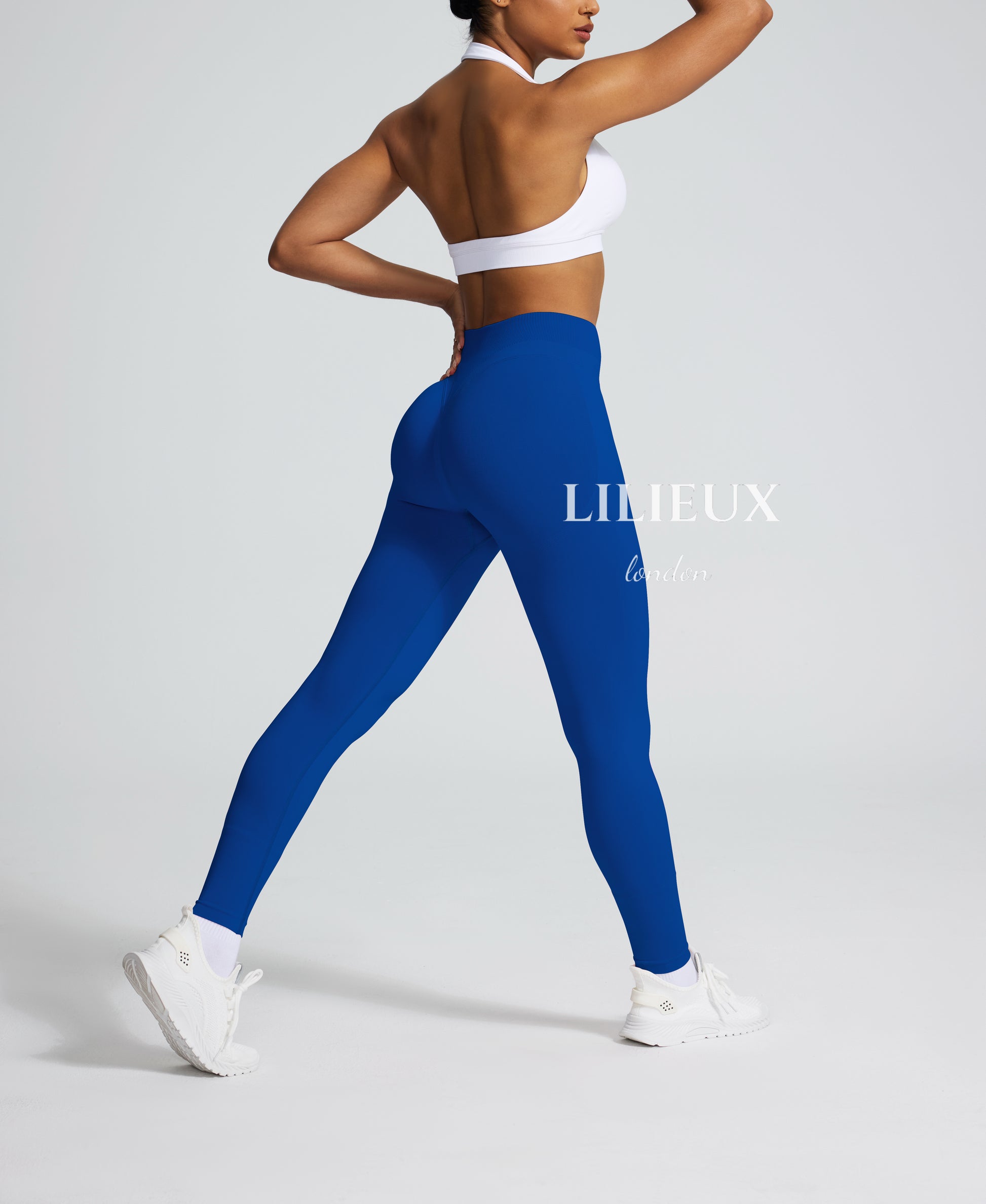 Figure-enhancing high-waisted blue leggings with a compression fit, perfect for gym, fitness, and everyday activewear style.