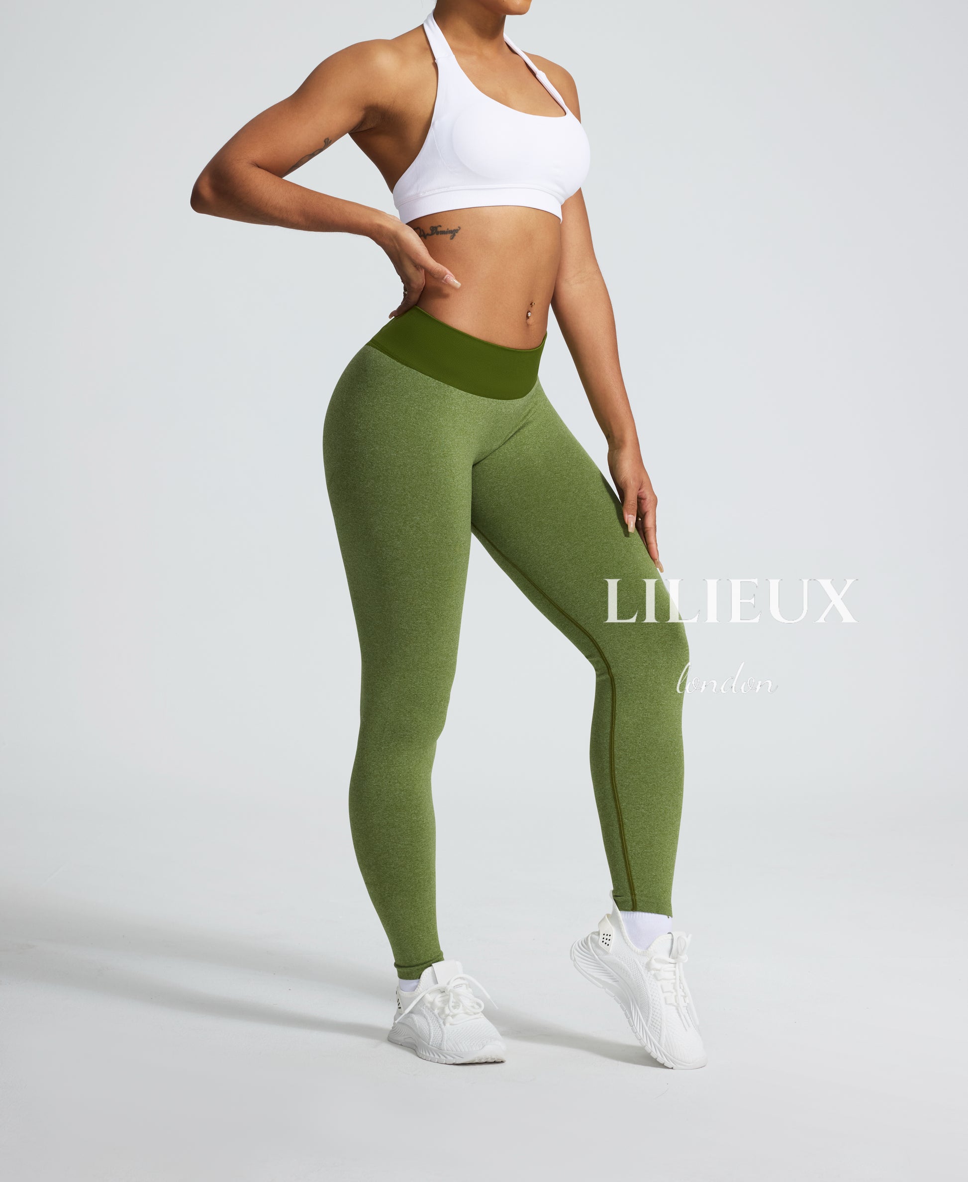 Green seamless high-waist gym leggings with a ribbed waistband, designed for support, shape-enhancement, and comfortable movement during workouts.