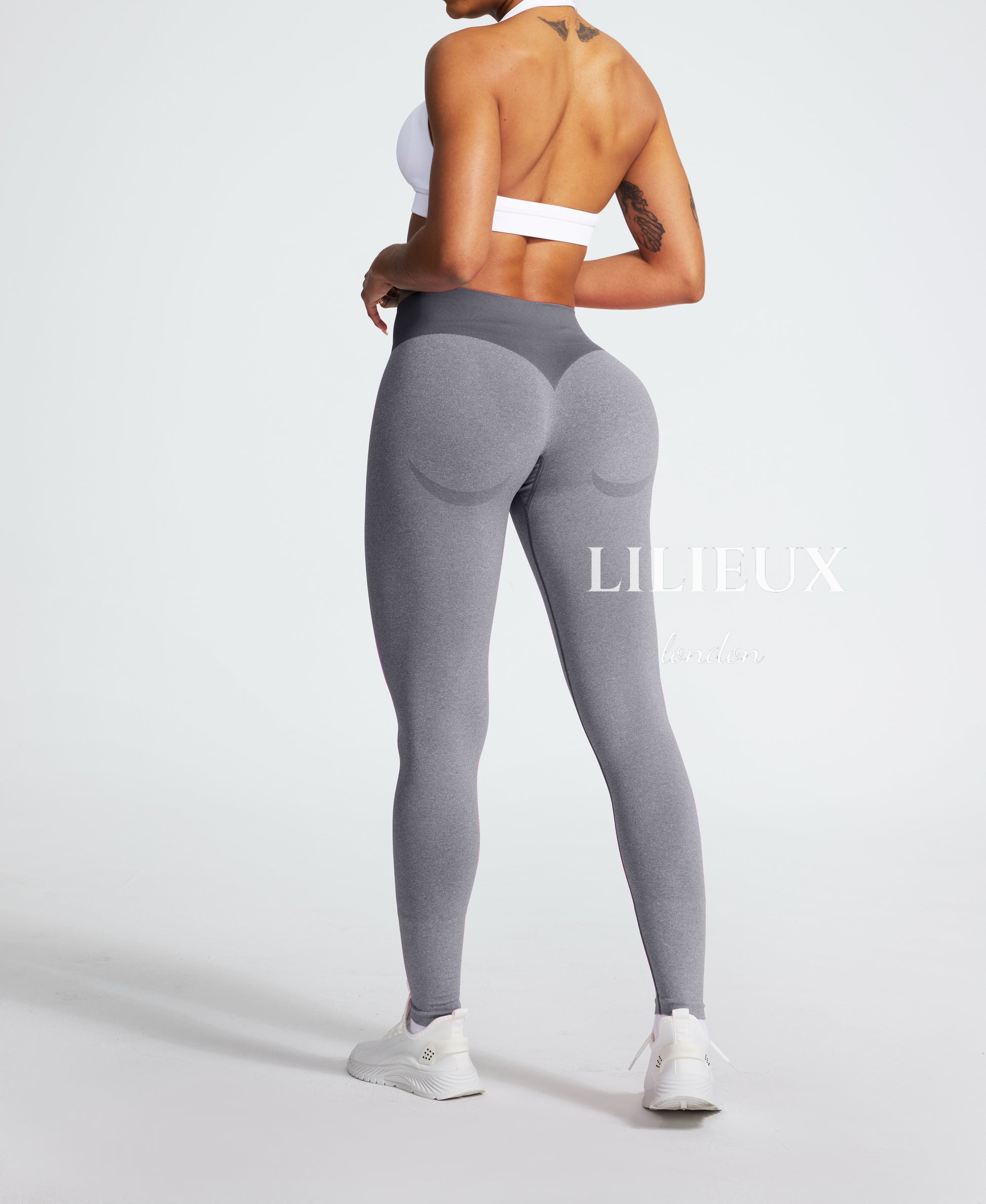 Back view of high-waisted grey seamless leggings with butt-lifting contour design, ideal for gym, yoga, and fitness wear.