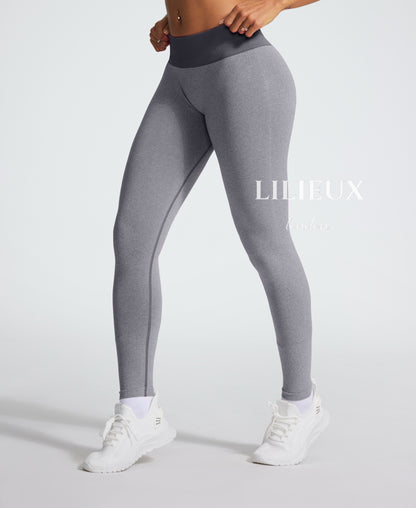 High-waisted grey seamless gym leggings for women, designed for comfort, flexibility, and performance during workouts.