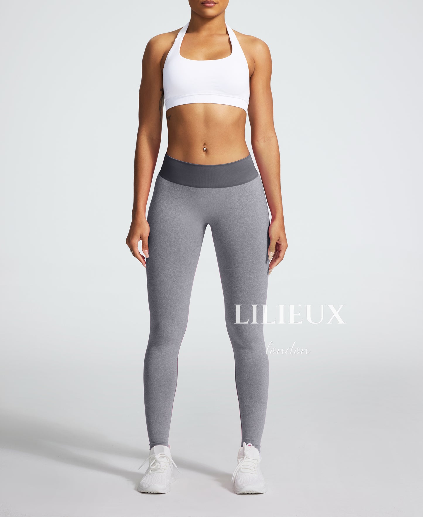 Front view of high-waisted grey seamless leggings for women, featuring a ribbed waistband and a snug fit for gym, yoga, and fitness activities.
