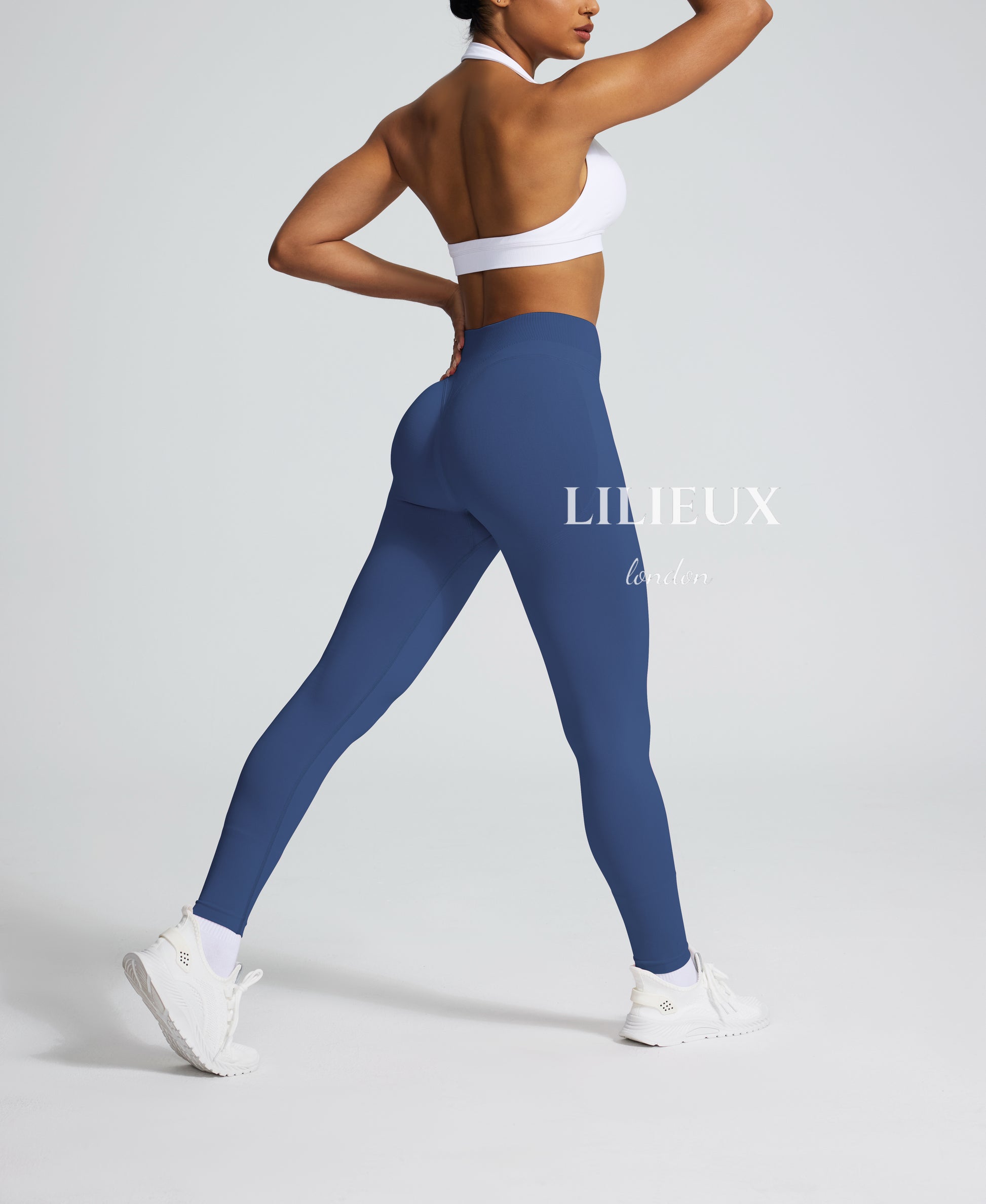 Form-fitting blue leggings with a high waistband and sculpting design, ideal for fitness, yoga, and casual activewear styling.