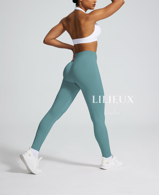 Women's seamless blue butt-lifting leggings designed for workouts, yoga, and everyday activewear comfort.